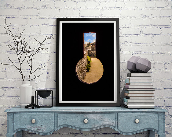 Framed Peephole Reclined on Desk Against Wall